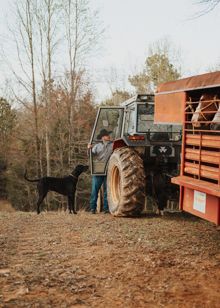 Alex turning off tractor before engagement session