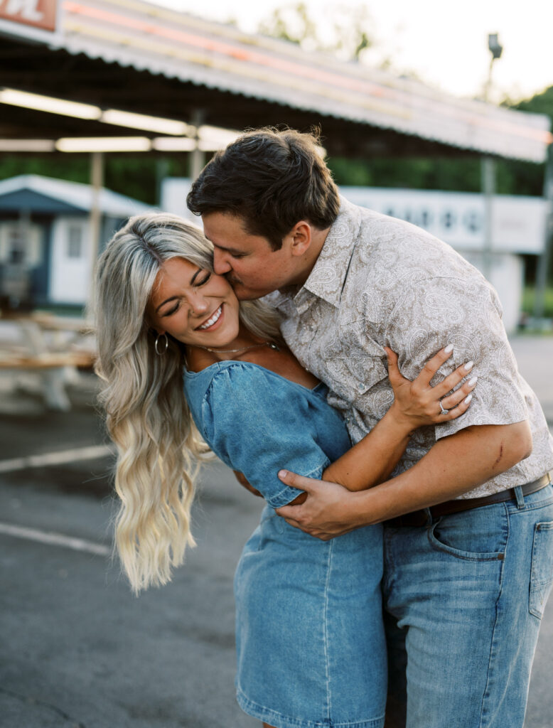 Engaged couple in front of drive in diner for Retrostyle engagement pictures