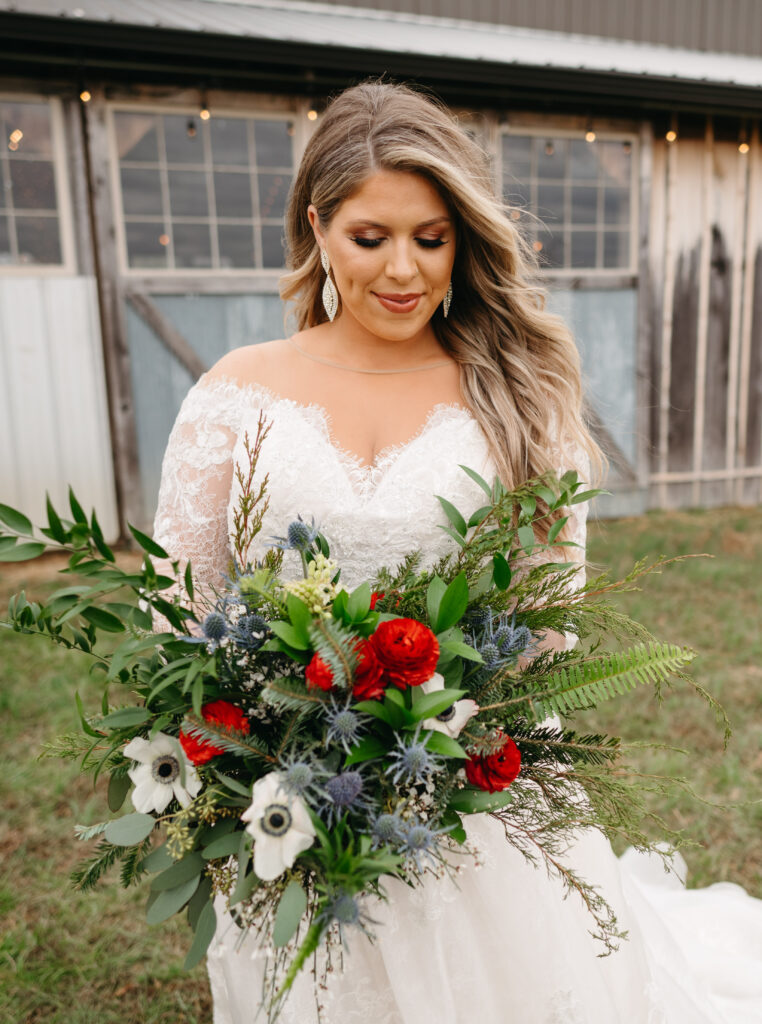 Bride admiring winter bouquet