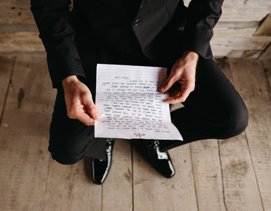 Groom reading note from bride