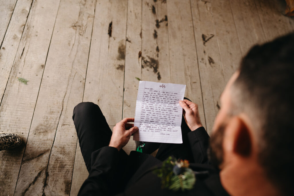 Groom reading note from bride