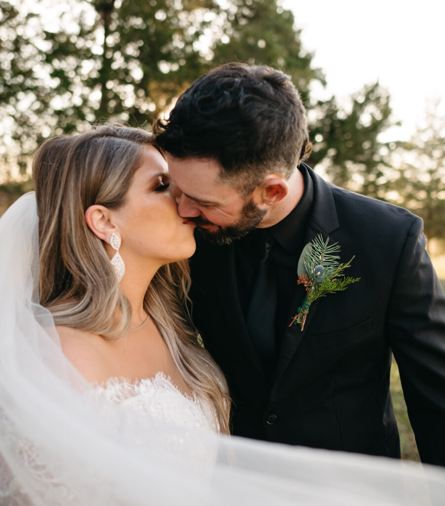 Bride and Groom kissing at winter wedding