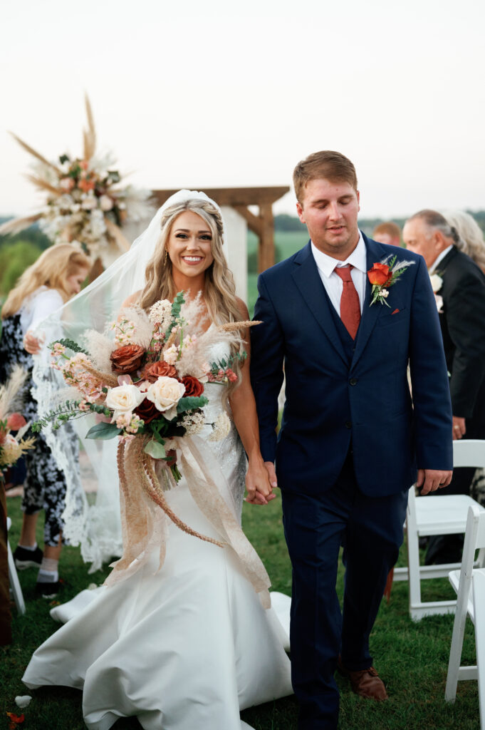 Bride and groom returning down the aisle. 