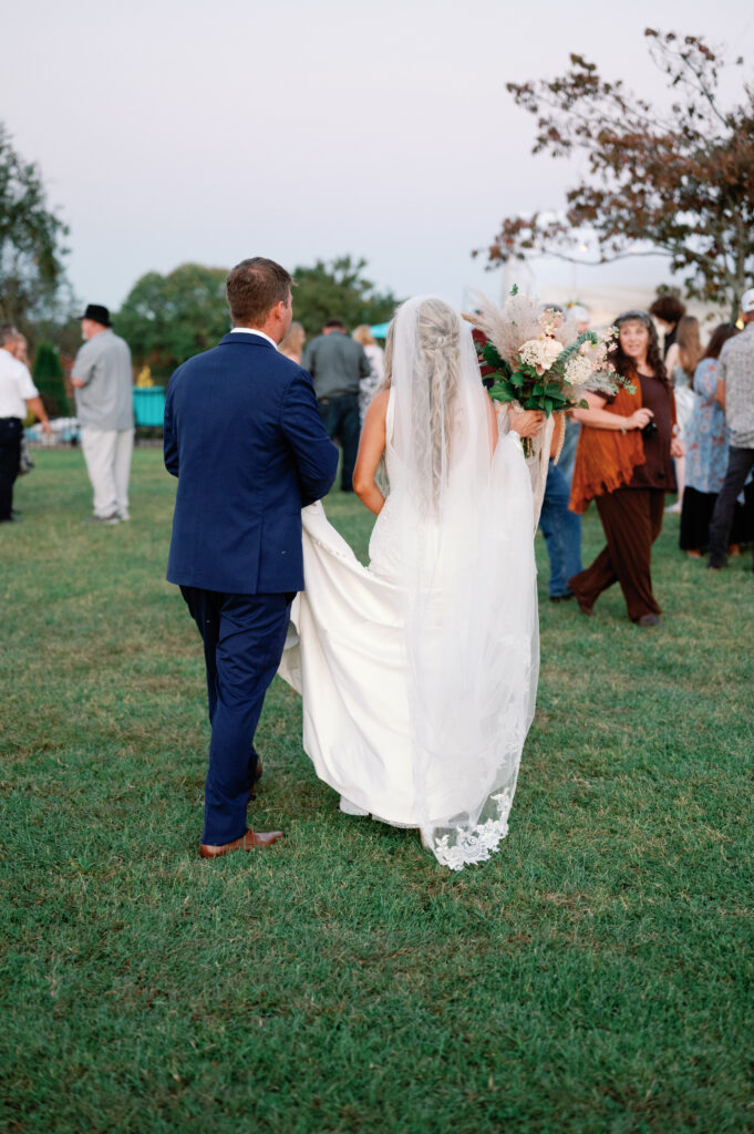 Bride and groom walking away