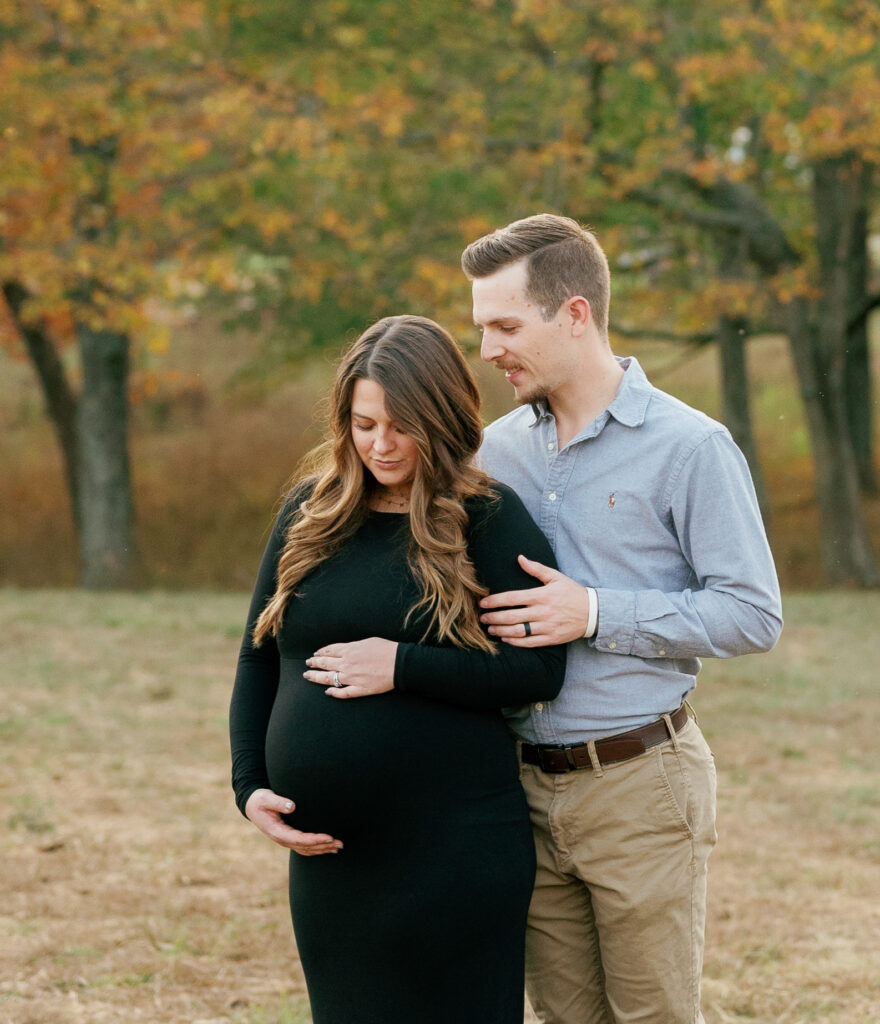 Expectant couple poses for maternity pictures near Nashville, Tennessee. 