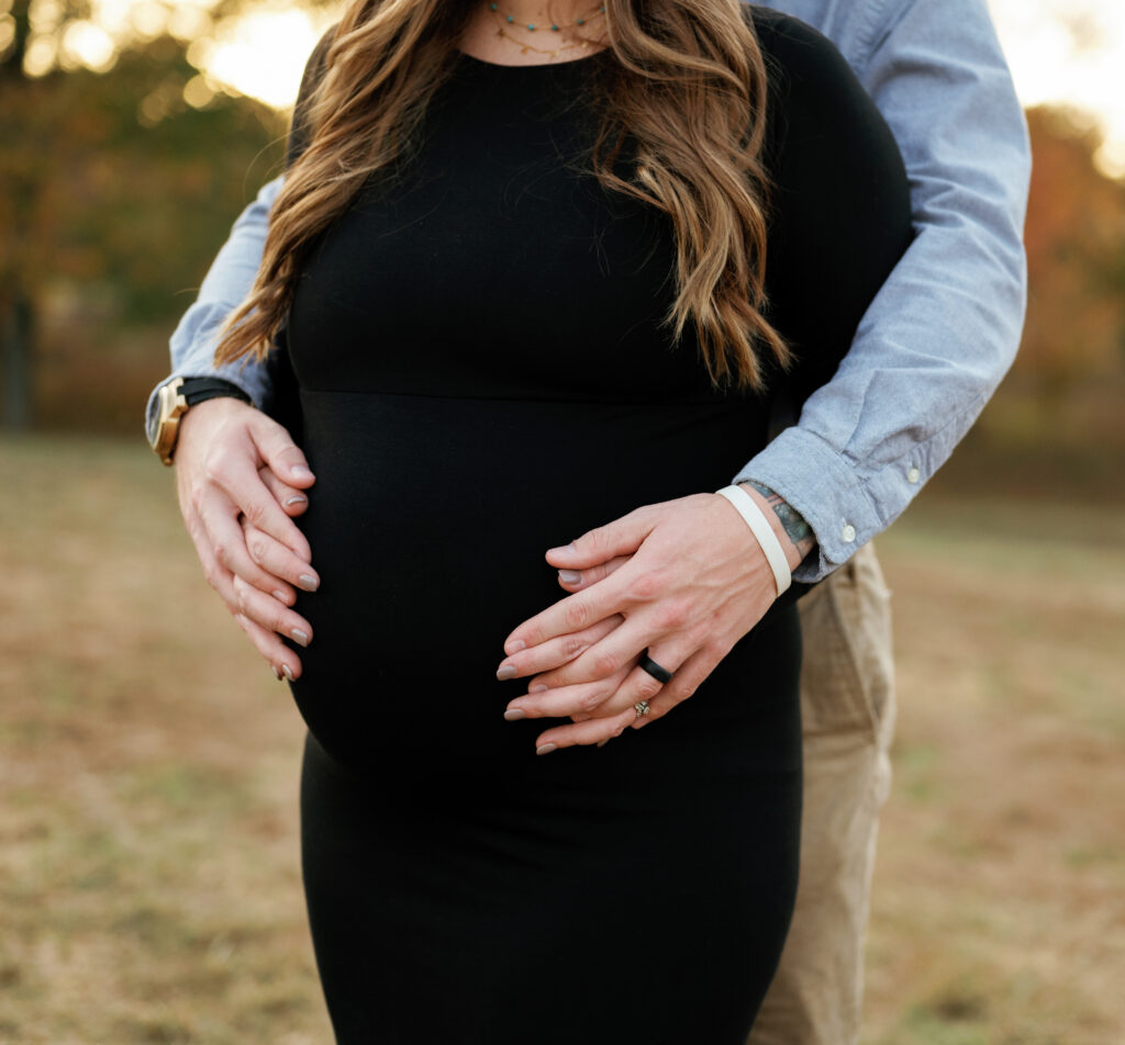 Expectant couple poses for maternity pictures near Nashville, Tennessee. 