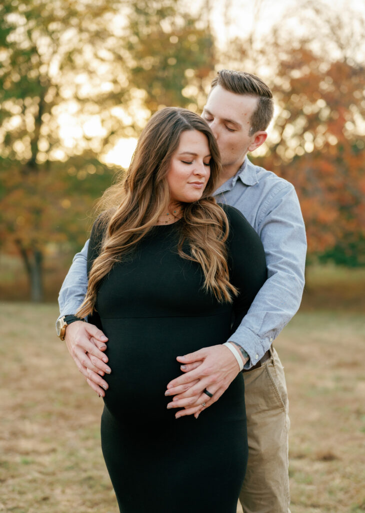 Expectant couple poses for maternity pictures near Nashville, Tennessee. 