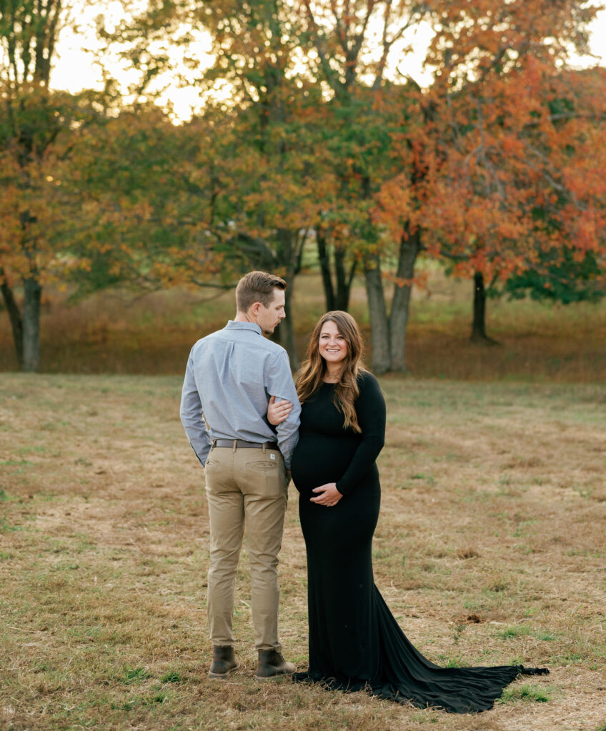 Expectant couple poses for maternity pictures near Nashville, Tennessee. 