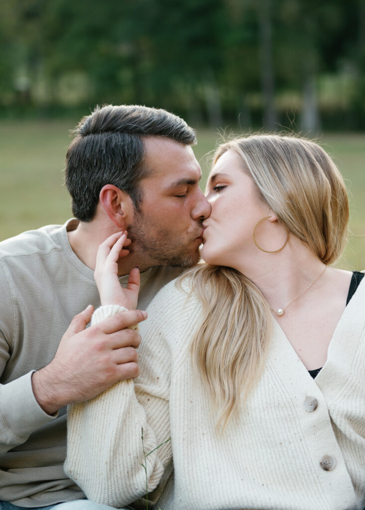 Couple posing in field for their Nashville Engagement pictures. 