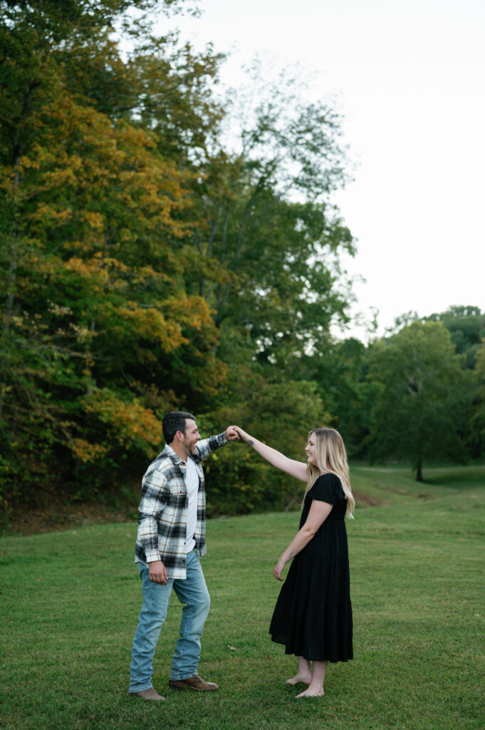 Couple posing in field for their Nashville Engagement pictures. 