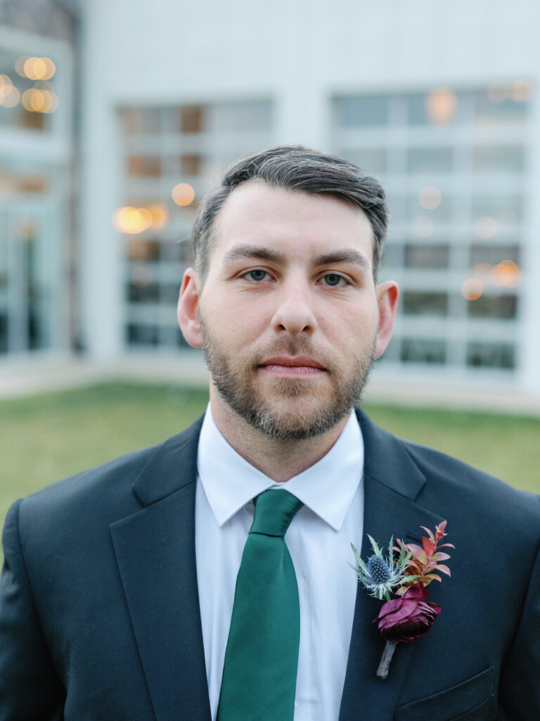 Groom posing for picture. 